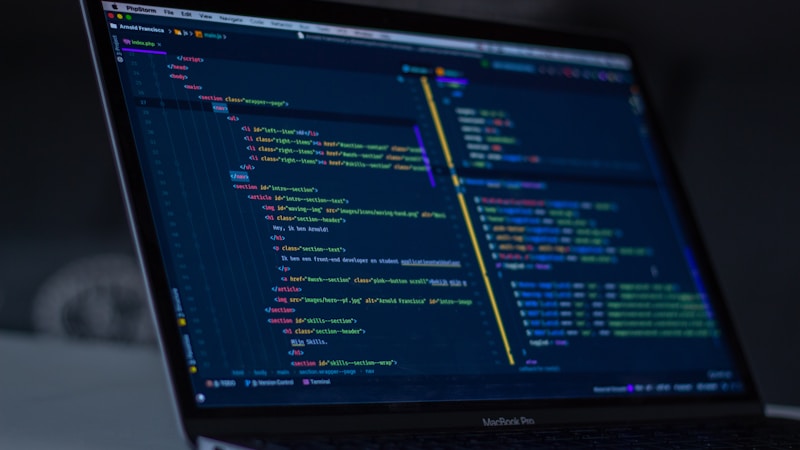 Developer workspace with AI agent frameworks and code pipelines displayed on multiple monitors